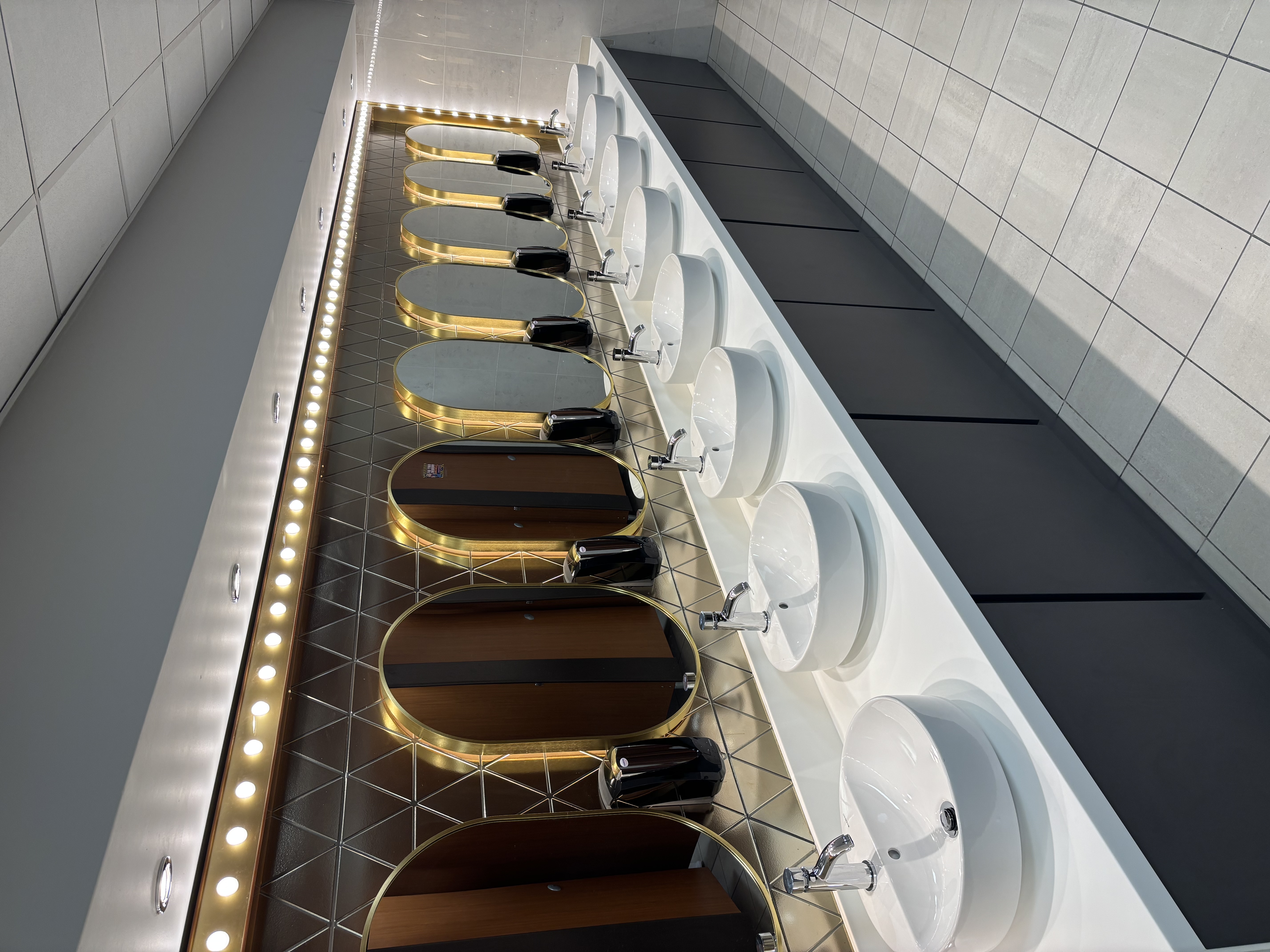 Completed illuminated mirrors and washbasins at the bingo club